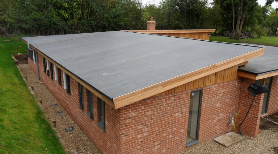 Completed flat roofing system